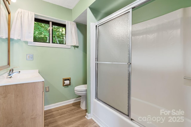 55 Lookout Dr, Asheville, NC 28804 - bathroom featuring vanity, wood finished floors, and shower / bath combination with glass door