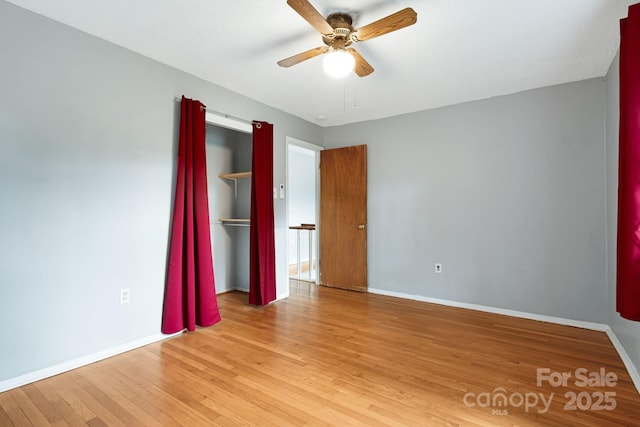 55 Lookout Dr, Asheville, NC 28804 - unfurnished bedroom featuring light wood-style floors, a closet, and ceiling fan