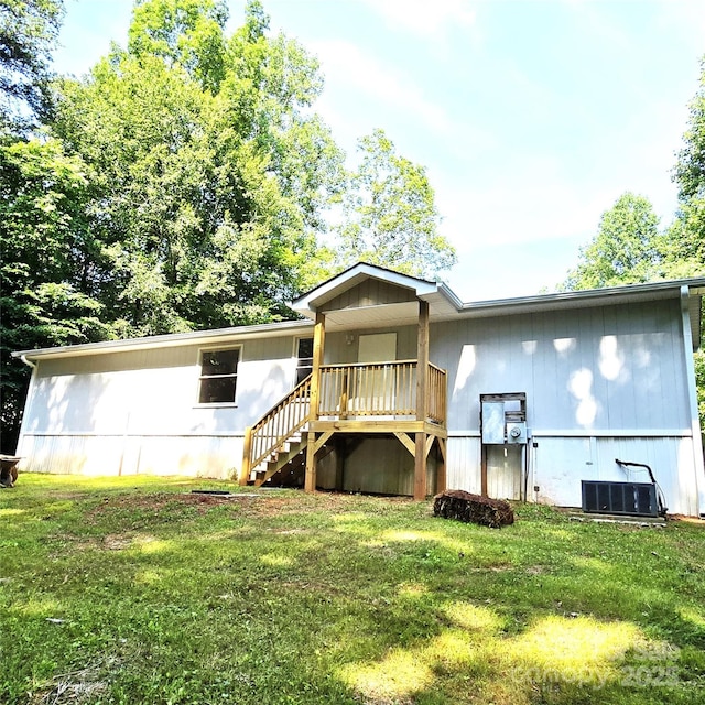 105 Damron Ln Unit 20, Harmony, NC 28634 - back of house featuring a lawn, stairway, and covered porch