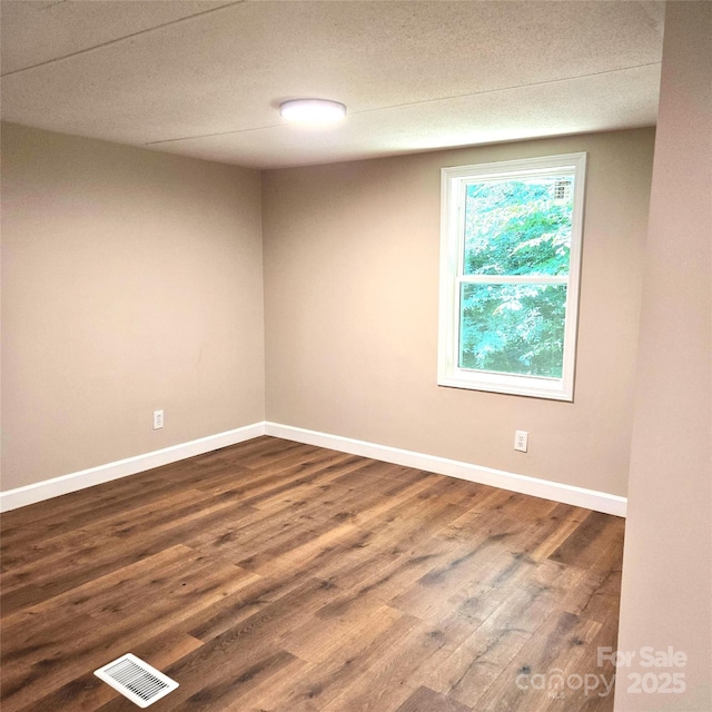 105 Damron Ln Unit 20, Harmony, NC 28634 - unfurnished room featuring dark wood-style floors and baseboards