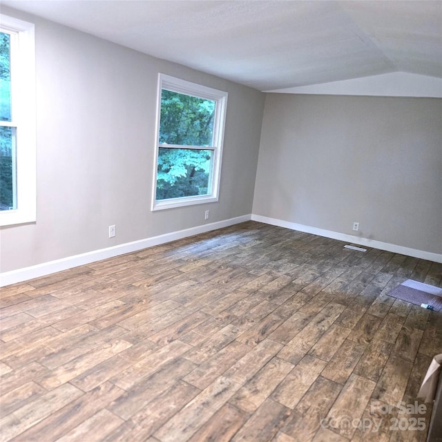 105 Damron Ln Unit 20, Harmony, NC 28634 - empty room featuring lofted ceiling and dark wood finished floors