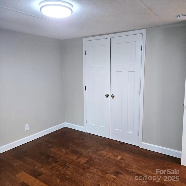 105 Damron Ln Unit 20, Harmony, NC 28634 - unfurnished bedroom with dark wood-style floors and a closet