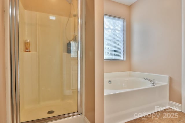 111 Painted Bunting Dr, Troutman, NC 28166 - full bath featuring a shower stall, a garden tub, and tile patterned floors