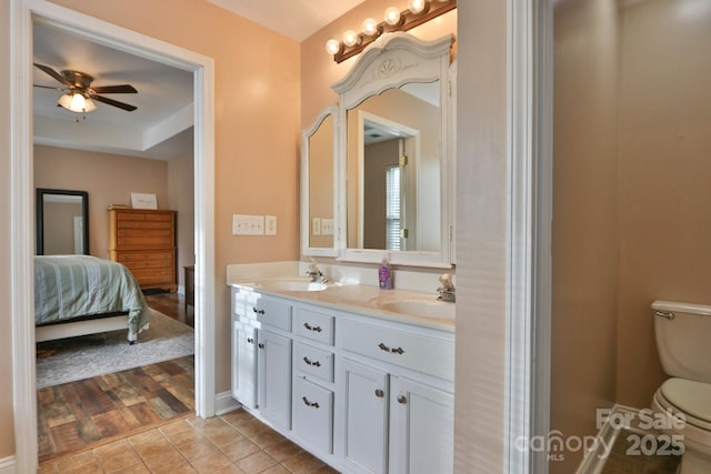 111 Painted Bunting Dr, Troutman, NC 28166 - full bathroom with double vanity, ceiling fan, and tile patterned flooring