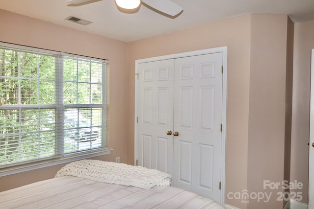 111 Painted Bunting Dr, Troutman, NC 28166 - bedroom featuring a closet and ceiling fan