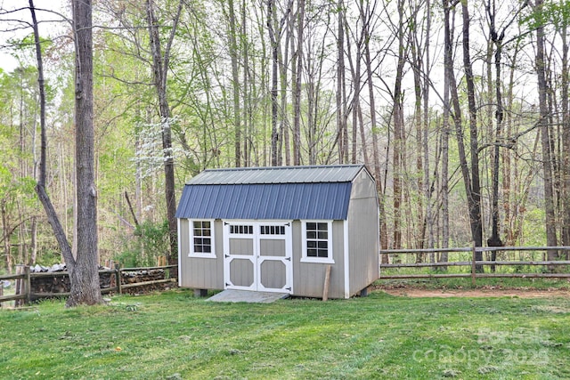 111 Painted Bunting Dr, Troutman, NC 28166 - view of shed featuring a fenced backyard and a view of trees