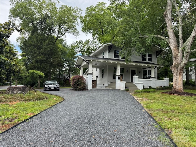 616 W Marion St, Shelby, NC 28150 - view of front of property with gravel driveway, covered porch, and a front lawn