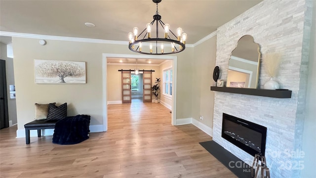 616 W Marion St, Shelby, NC 28150 - hall with a chandelier, crown molding, wood finished floors, and a barn door