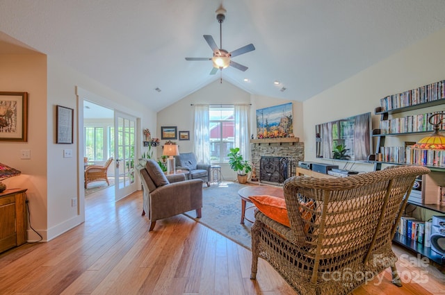 38 Westfield Way, Candler, NC 28715 - living room with wood finished floors, a ceiling fan, a stone fireplace, and high vaulted ceiling