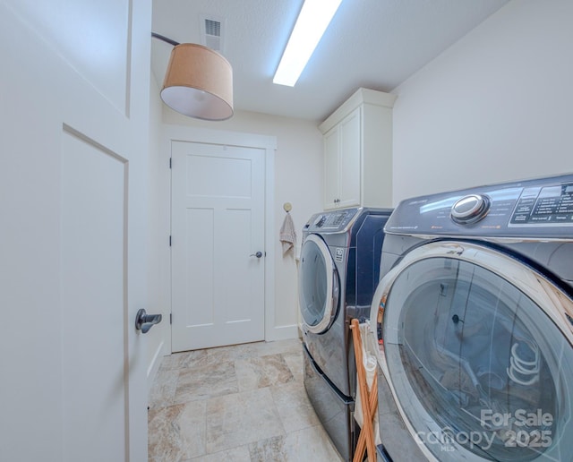 38 Westfield Way, Candler, NC 28715 - washroom with washing machine and dryer and cabinet space