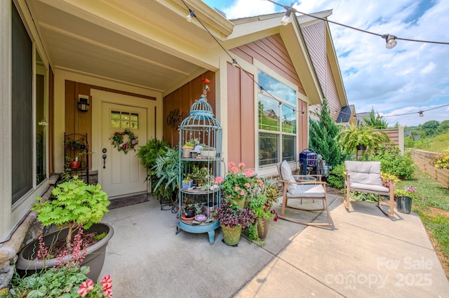 38 Westfield Way, Candler, NC 28715 - entrance to property featuring board and batten siding and a patio