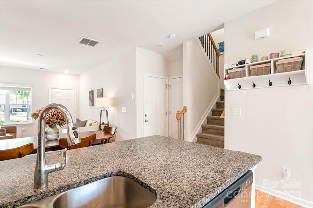 6507 Revolutionary Trl, Charlotte, NC 28217 - kitchen featuring stone counters and dishwasher