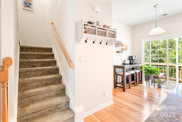6507 Revolutionary Trl, Charlotte, NC 28217 - stairs with wood finished floors and baseboards