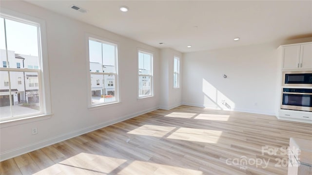 2143 Barrowcliffe Dr NW, Concord, NC 28027 - kitchen featuring appliances with stainless steel finishes, light wood-style flooring, white cabinetry, and recessed lighting