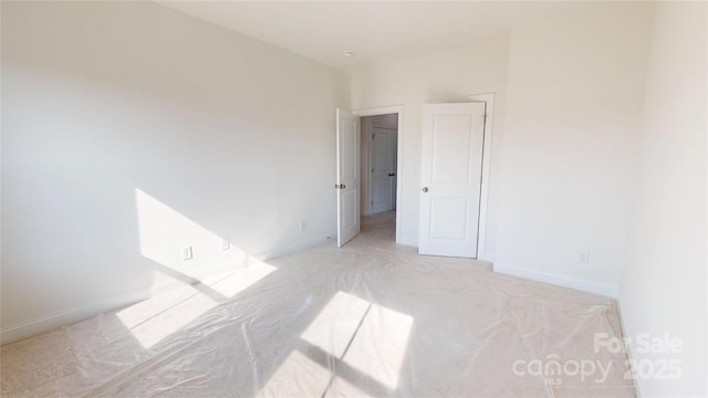 2143 Barrowcliffe Dr NW, Concord, NC 28027 - empty room with baseboards and light colored carpet