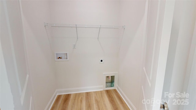 2143 Barrowcliffe Dr NW, Concord, NC 28027 - washroom with washer hookup, hookup for an electric dryer, and light wood-style flooring