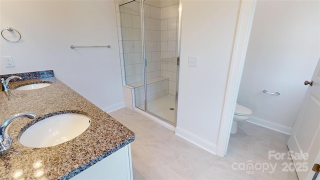 2143 Barrowcliffe Dr NW, Concord, NC 28027 - bathroom with a shower stall, double vanity, and tile patterned floors