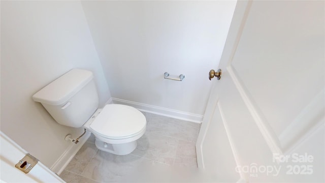 2143 Barrowcliffe Dr NW, Concord, NC 28027 - bathroom with toilet and baseboards