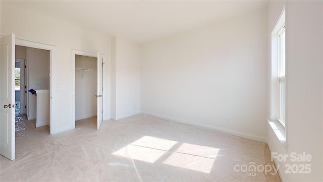2143 Barrowcliffe Dr NW, Concord, NC 28027 - unfurnished bedroom featuring light carpet and a closet