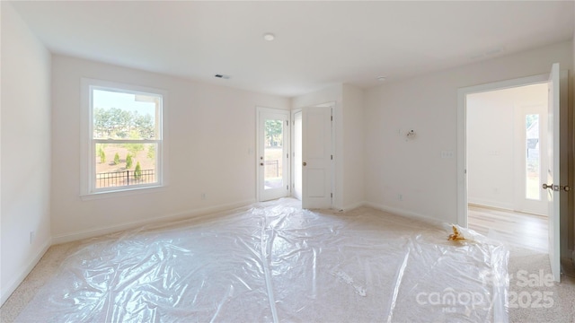2143 Barrowcliffe Dr NW, Concord, NC 28027 - empty room featuring baseboards and light carpet