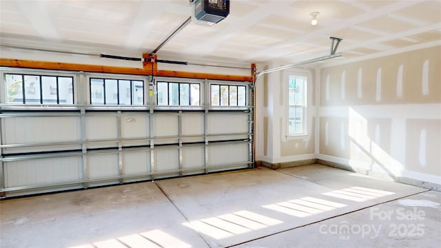 2143 Barrowcliffe Dr NW, Concord, NC 28027 - garage featuring a garage door opener and baseboards