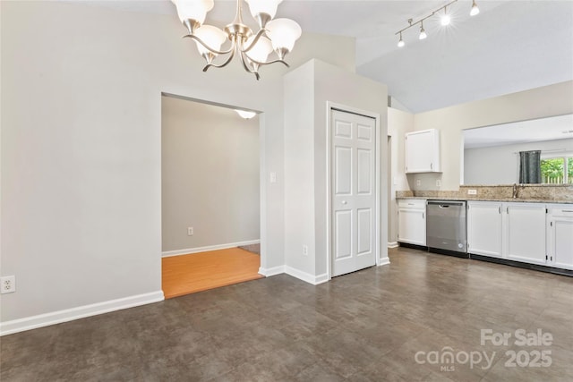8724 Tweedsmuir Glen Ln, Charlotte, NC 28215 - kitchen featuring stainless steel dishwasher, white cabinetry, a chandelier, vaulted ceiling, and light stone counters