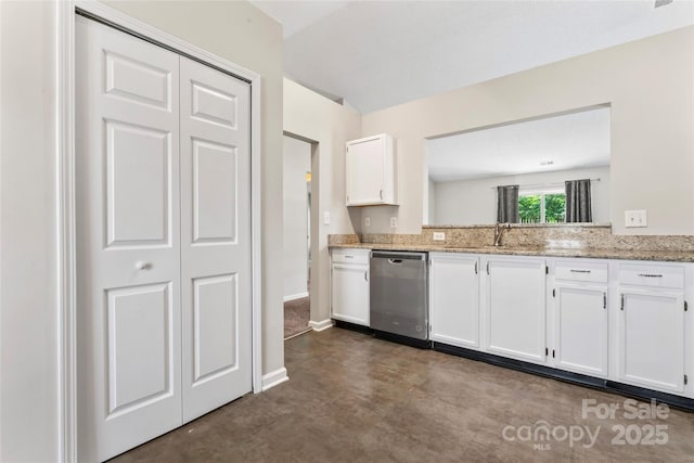 8724 Tweedsmuir Glen Ln, Charlotte, NC 28215 - kitchen with dishwasher, white cabinetry, light stone counters, and finished concrete flooring