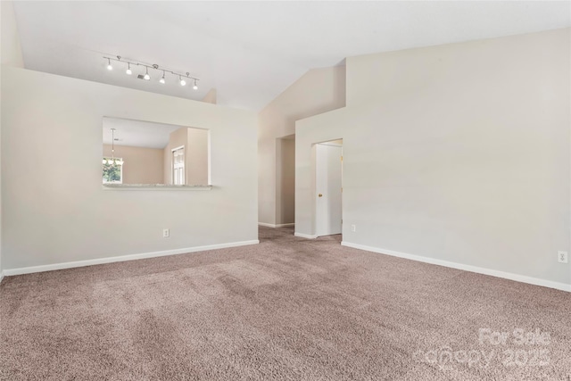 8724 Tweedsmuir Glen Ln, Charlotte, NC 28215 - carpeted spare room featuring lofted ceiling, track lighting, and a chandelier
