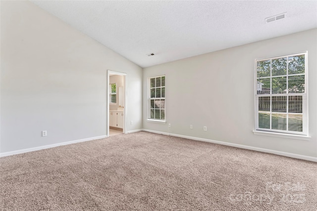 8724 Tweedsmuir Glen Ln, Charlotte, NC 28215 - unfurnished room featuring carpet flooring, a textured ceiling, and lofted ceiling