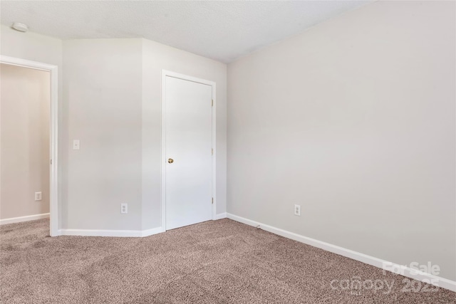 8724 Tweedsmuir Glen Ln, Charlotte, NC 28215 - unfurnished bedroom with carpet floors and baseboards