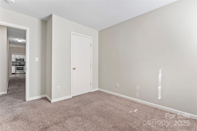 8724 Tweedsmuir Glen Ln, Charlotte, NC 28215 - unfurnished bedroom with carpet and a textured ceiling