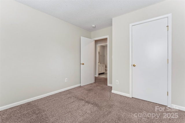 8724 Tweedsmuir Glen Ln, Charlotte, NC 28215 - unfurnished bedroom featuring carpet floors and a textured ceiling