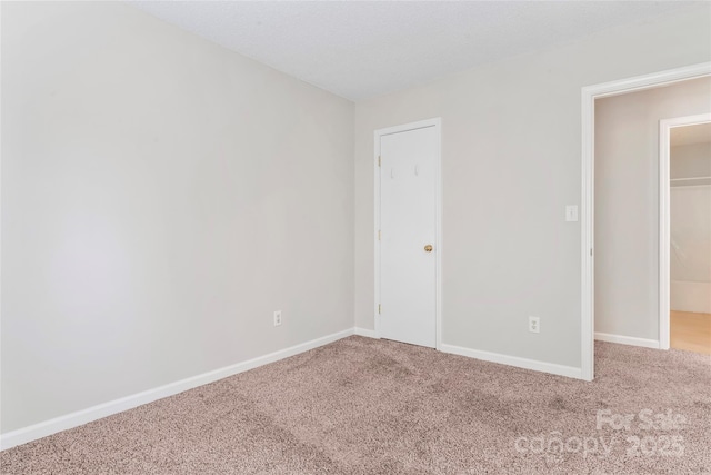 8724 Tweedsmuir Glen Ln, Charlotte, NC 28215 - unfurnished bedroom with carpet floors and baseboards