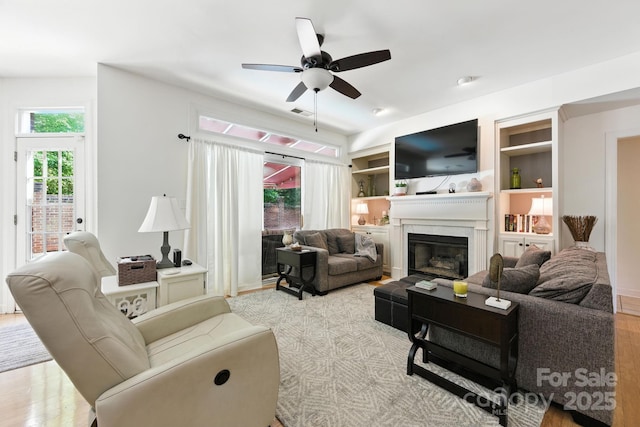 7014 Walton Heath Ln, Charlotte, NC 28277 - living area with a ceiling fan, a high end fireplace, and wood finished floors