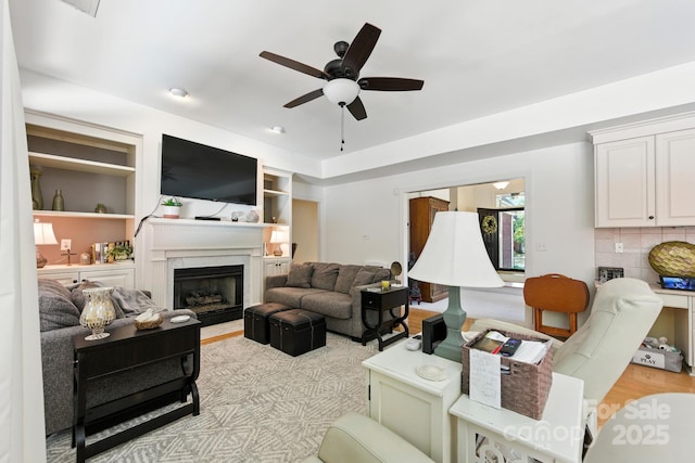 7014 Walton Heath Ln, Charlotte, NC 28277 - living room with a ceiling fan, a high end fireplace, and light wood-style flooring