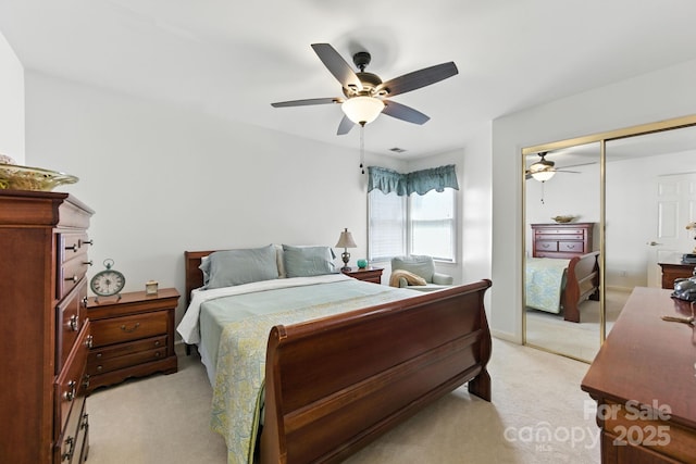 7014 Walton Heath Ln, Charlotte, NC 28277 - bedroom featuring light colored carpet, a closet, and a ceiling fan