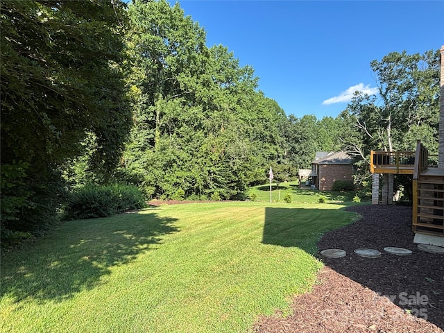 1335 33rd Avenue Dr NE, Hickory, NC 28601 - view of green lawn with stairs and a deck