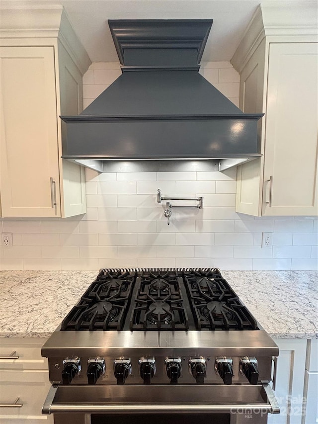 1335 33rd Avenue Dr NE, Hickory, NC 28601 - kitchen view of custom exhaust hood, pot filler, high end range, and white cabinets