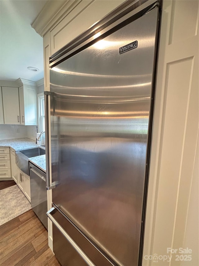 1335 33rd Avenue Dr NE, Hickory, NC 28601 - kitchen view of appliances with stainless steel finishes, dark wood finished floors, and white cabinetry