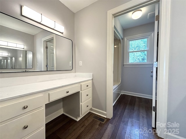 1335 33rd Avenue Dr NE, Hickory, NC 28601 - bathroom featuring wood-type flooring, vanity, and bathtub / shower combination