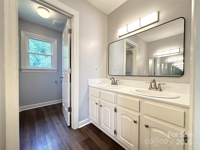 1335 33rd Avenue Dr NE, Hickory, NC 28601 - bathroom with double vanity and hardwood / wood-style flooring