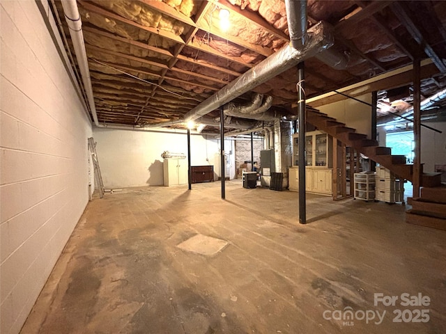 1335 33rd Avenue Dr NE, Hickory, NC 28601 - unfinished basement with stairway and concrete block wall