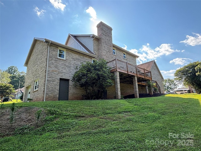 1335 33rd Avenue Dr NE, Hickory, NC 28601 - rear view of house featuring a yard, a deck, a chimney, and board and batten siding