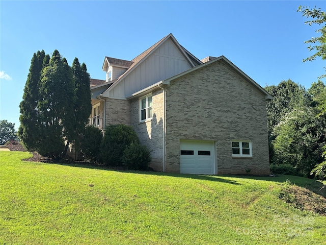 1335 33rd Avenue Dr NE, Hickory, NC 28601 - view of property exterior featuring brick siding, a garage, a lawn, and board and batten siding