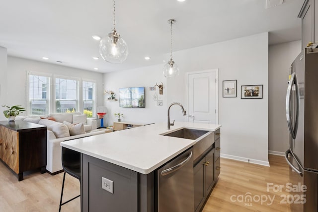 5008 Calvine Mill Way, Charlotte, NC 28205 - kitchen with appliances with stainless steel finishes, light wood-style flooring, light countertops, recessed lighting, and pendant lighting