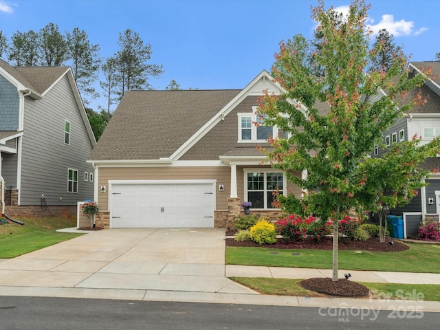 1008 Whipcord Dr, Waxhaw, NC 28173 - craftsman-style home with driveway, stone siding, a garage, and roof with shingles