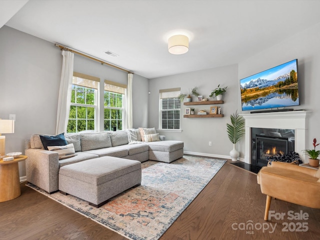 1008 Whipcord Dr, Waxhaw, NC 28173 - living area with wood finished floors and a fireplace with flush hearth