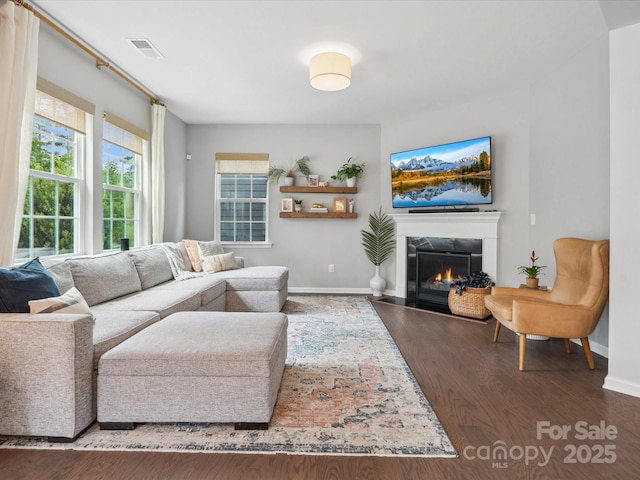 1008 Whipcord Dr, Waxhaw, NC 28173 - living room with a glass covered fireplace and wood finished floors