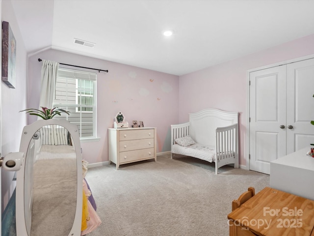 1008 Whipcord Dr, Waxhaw, NC 28173 - bedroom with light carpet, vaulted ceiling, a closet, and recessed lighting