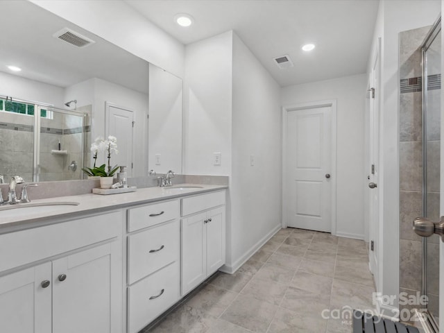 1008 Whipcord Dr, Waxhaw, NC 28173 - full bath featuring a shower stall, double vanity, and recessed lighting